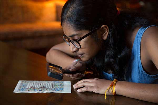 student studying historical manuscript