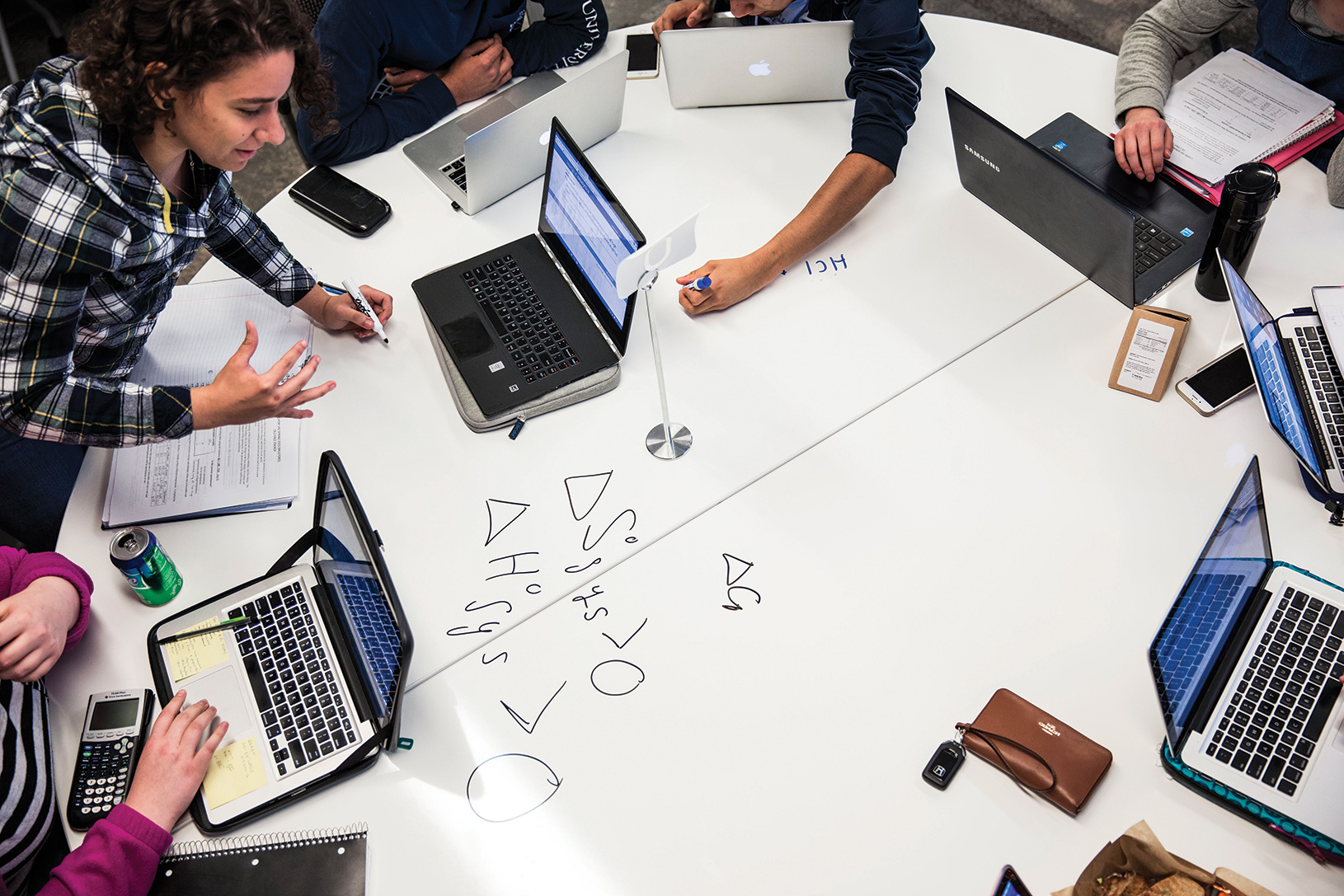 students working together with laptops