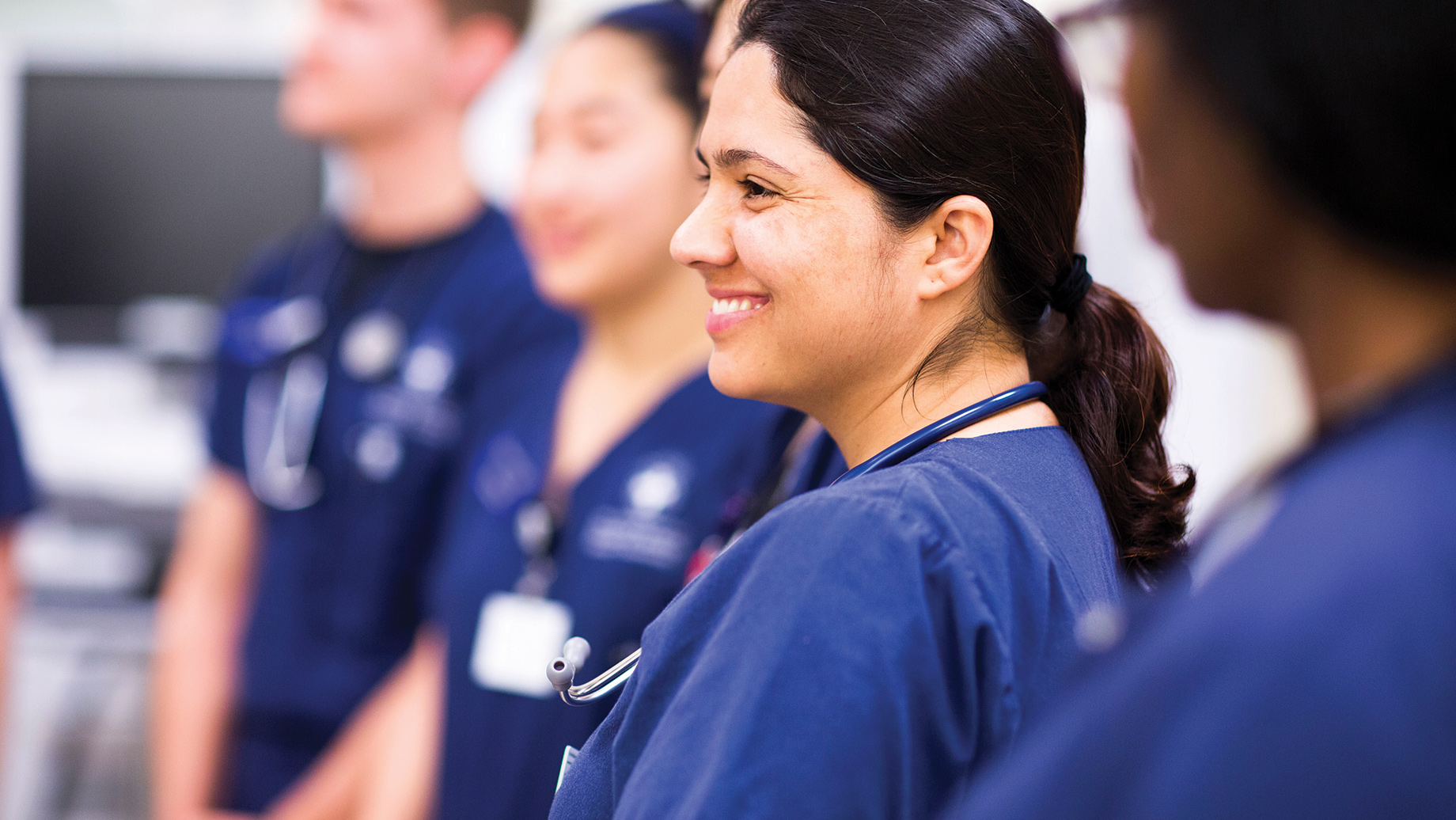 nursing students in blue scrubs