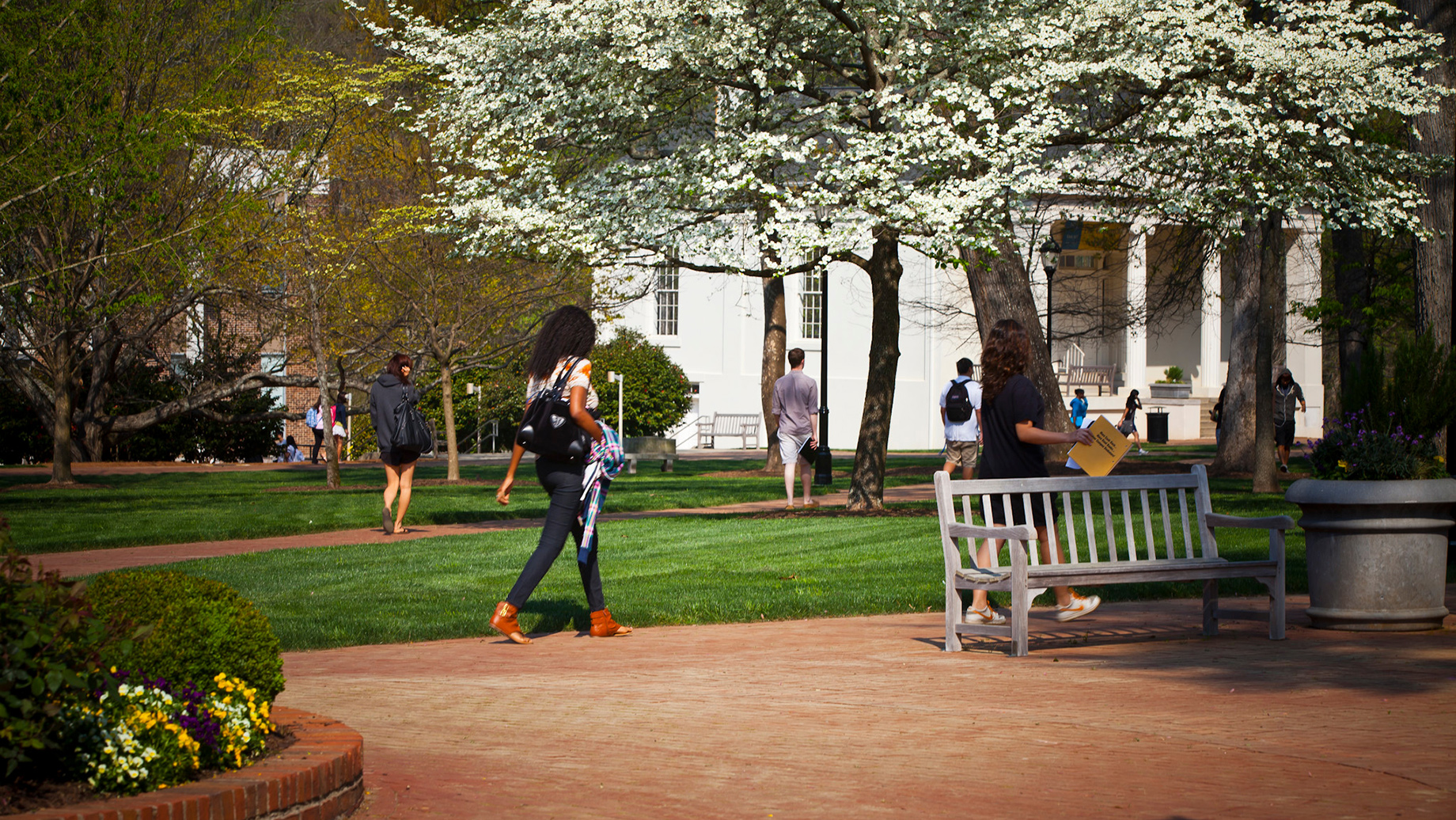 students walking across Oxford College campus in springtime